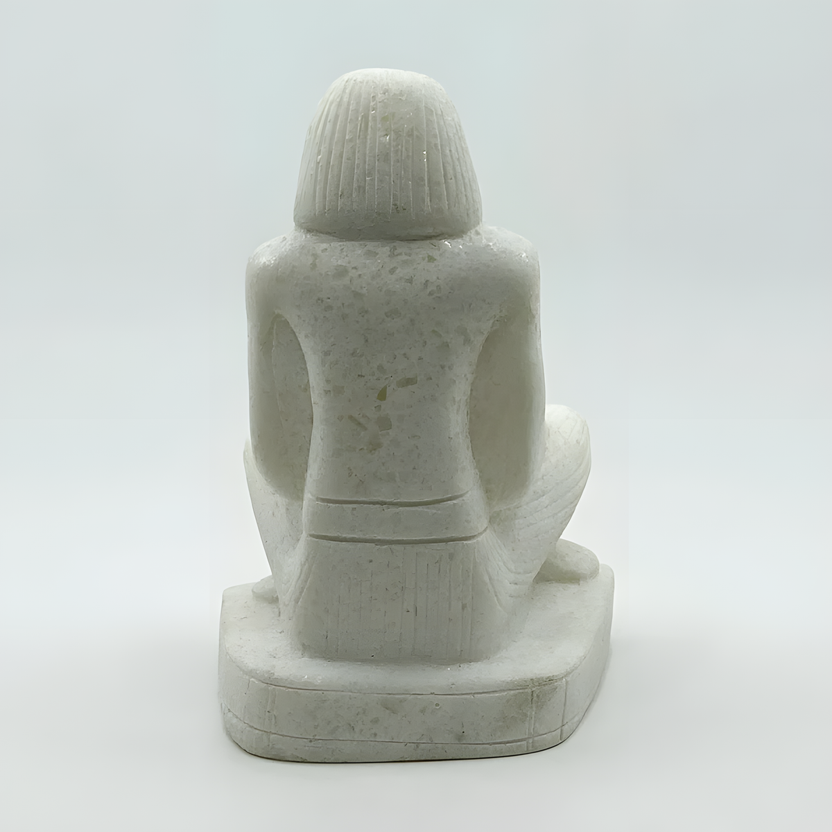 Alabaster seated Egyptian priest museum reproduction statue, side view