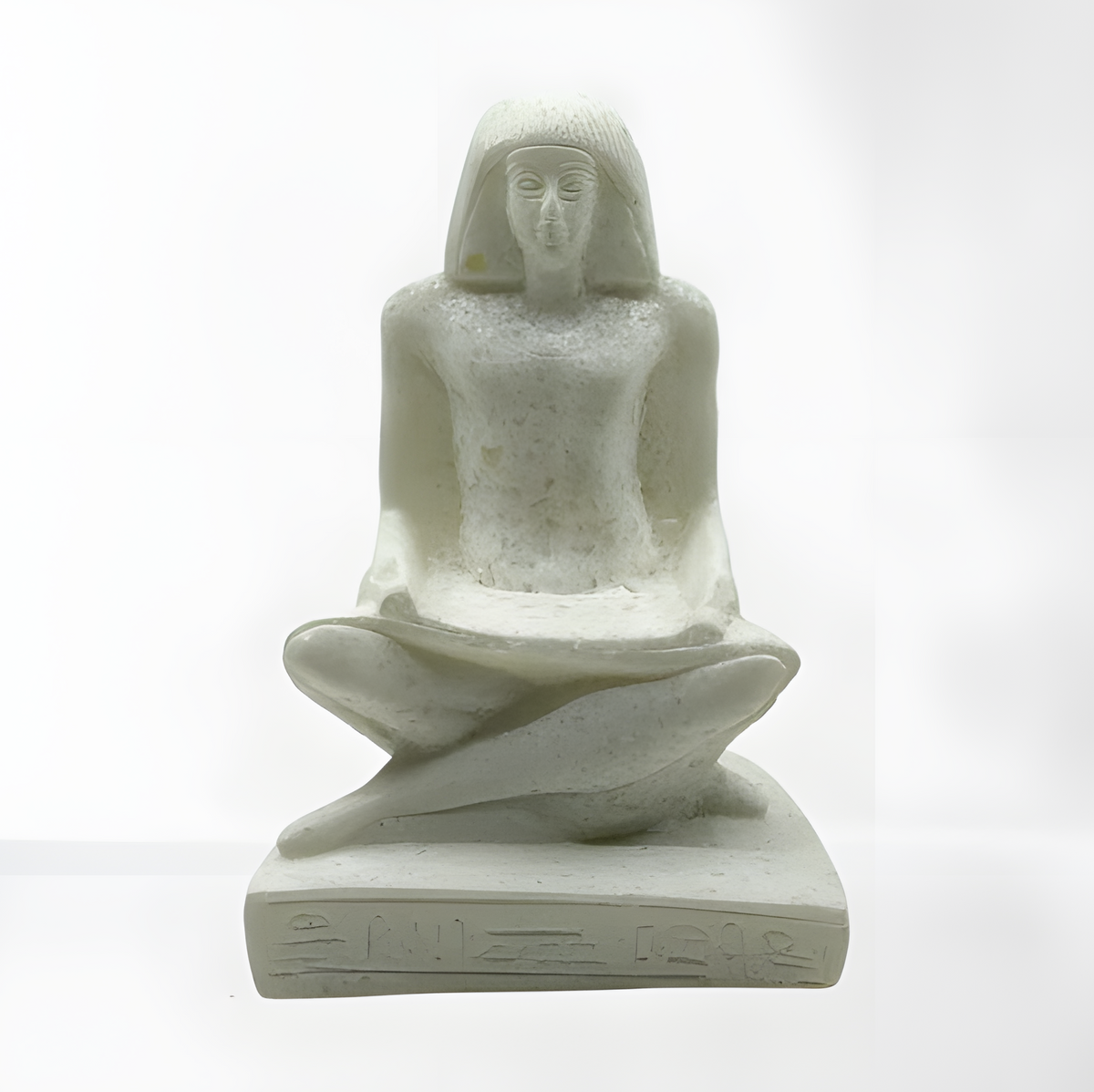 Close-up of the seated Egyptian priest museum reproduction holding a papyrus scroll
