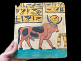Close-up detail of the hand-carved Apis Bull relief, museum reproduction