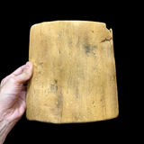 Apis Bull wooden tablet shown hanging on wall, museum reproduction