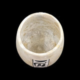Close-up of hand-carved alabaster texture on the Anubis vase, museum reproduction