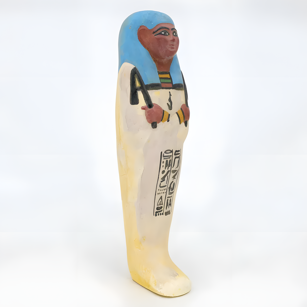 Side view of the limestone ushabti museum reproduction showing carved detail