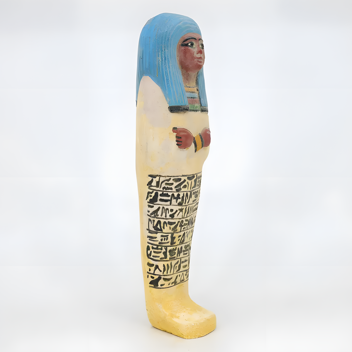 Side view of the limestone ushabti museum reproduction showing carved detail