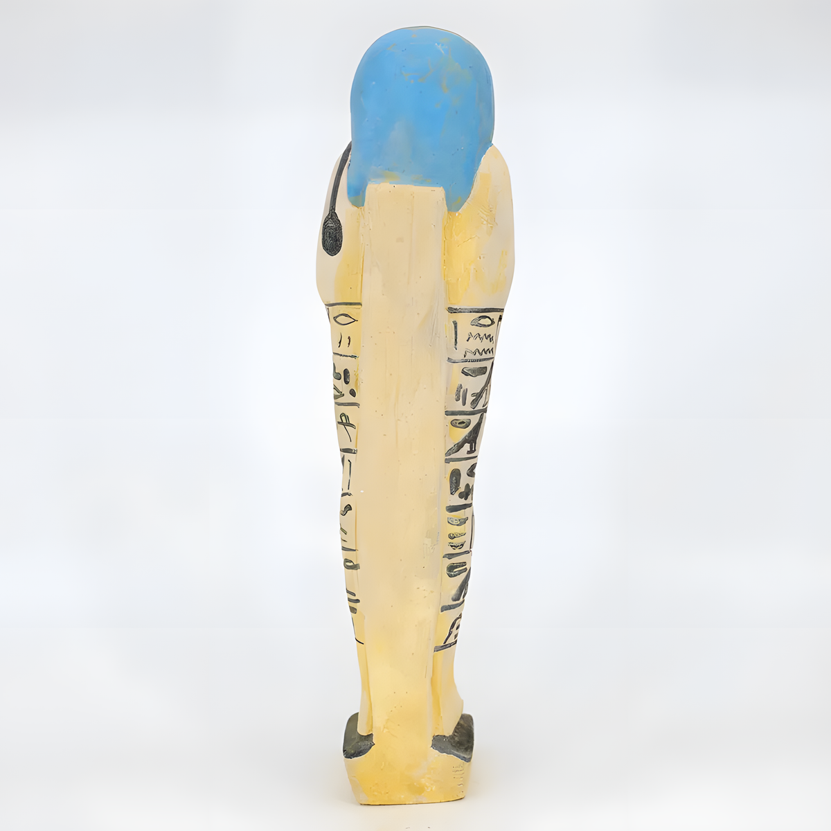 Side view of the limestone ushabti museum reproduction showing carved detail