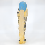 Side view of the limestone ushabti museum reproduction showing carved detail