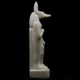 Back view of the alabaster Anubis statue showing carved detail, museum reproduction