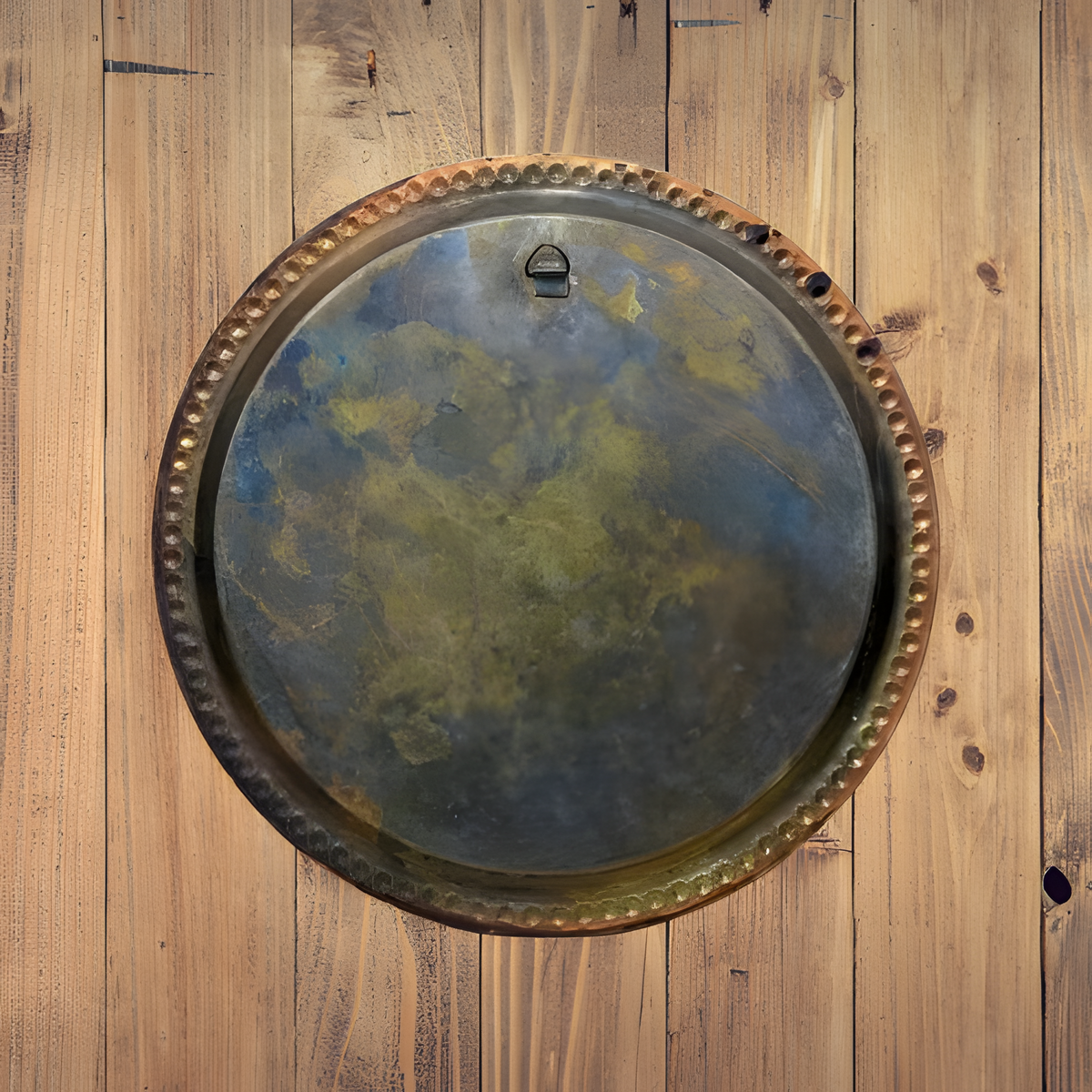 Copper decorative plate depicting a dance scene, hand-engraved wall art, back view