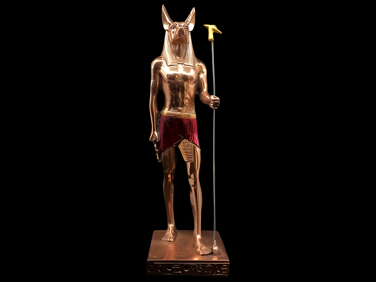 Back view of the copper Anubis statue showing carved detail, museum reproduction