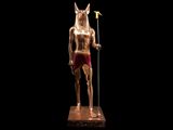 Back view of the copper Anubis statue showing carved detail, museum reproduction