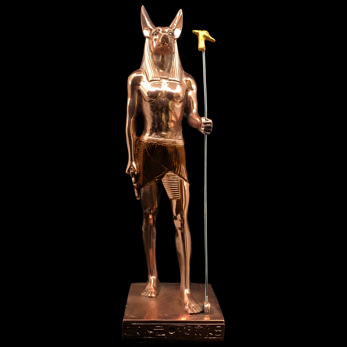 Full-length view of the copper Anubis statue on its base, museum reproduction