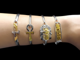 Handmade Egyptian brass charm bracelet featuring Isis, Ankh, Scarab, and Cartouche charms