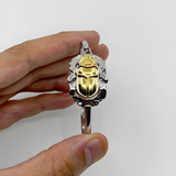 Close-up of the Isis charm on the handmade Egyptian brass bracelet