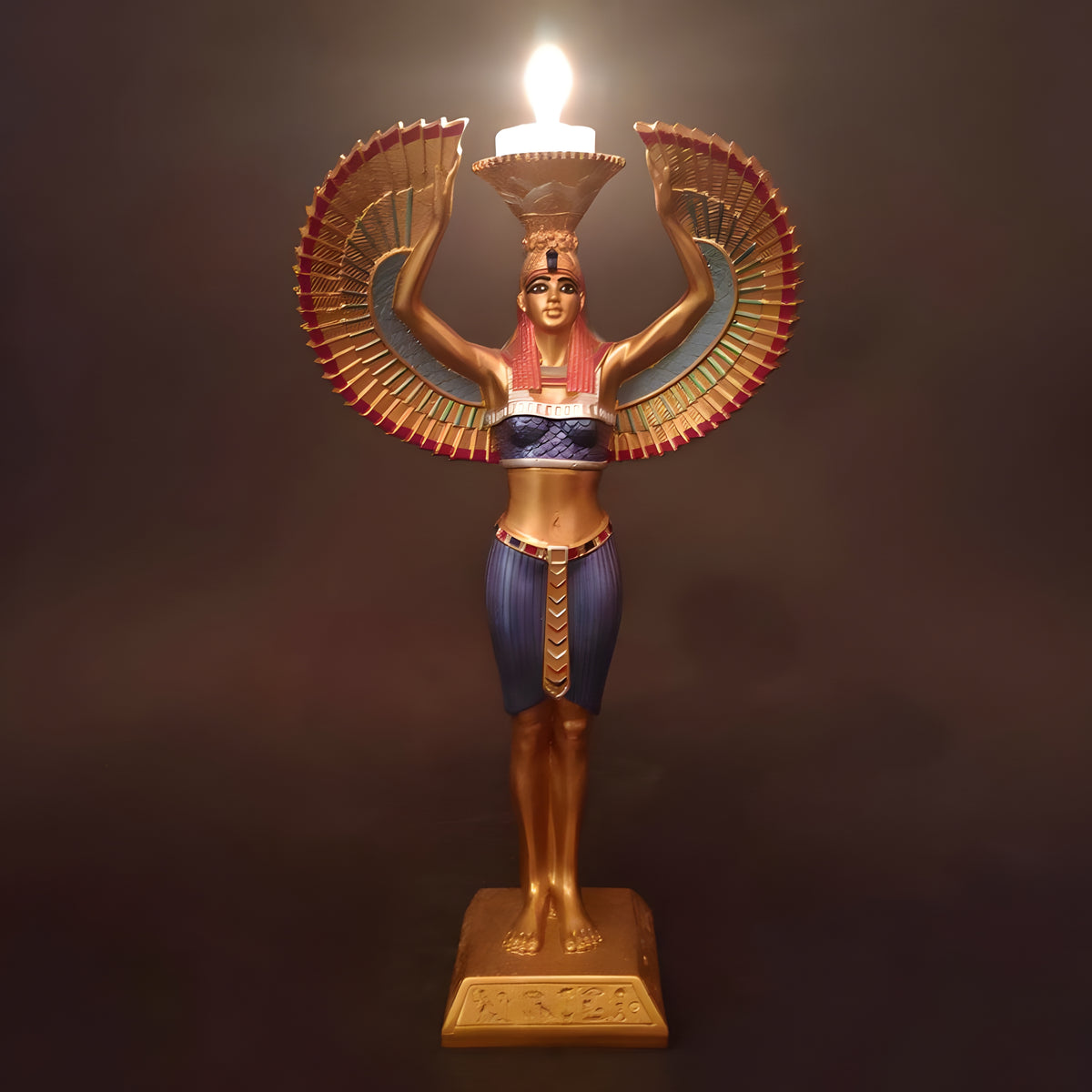Black and gold Isis statue with candle holder, museum reproduction, front view