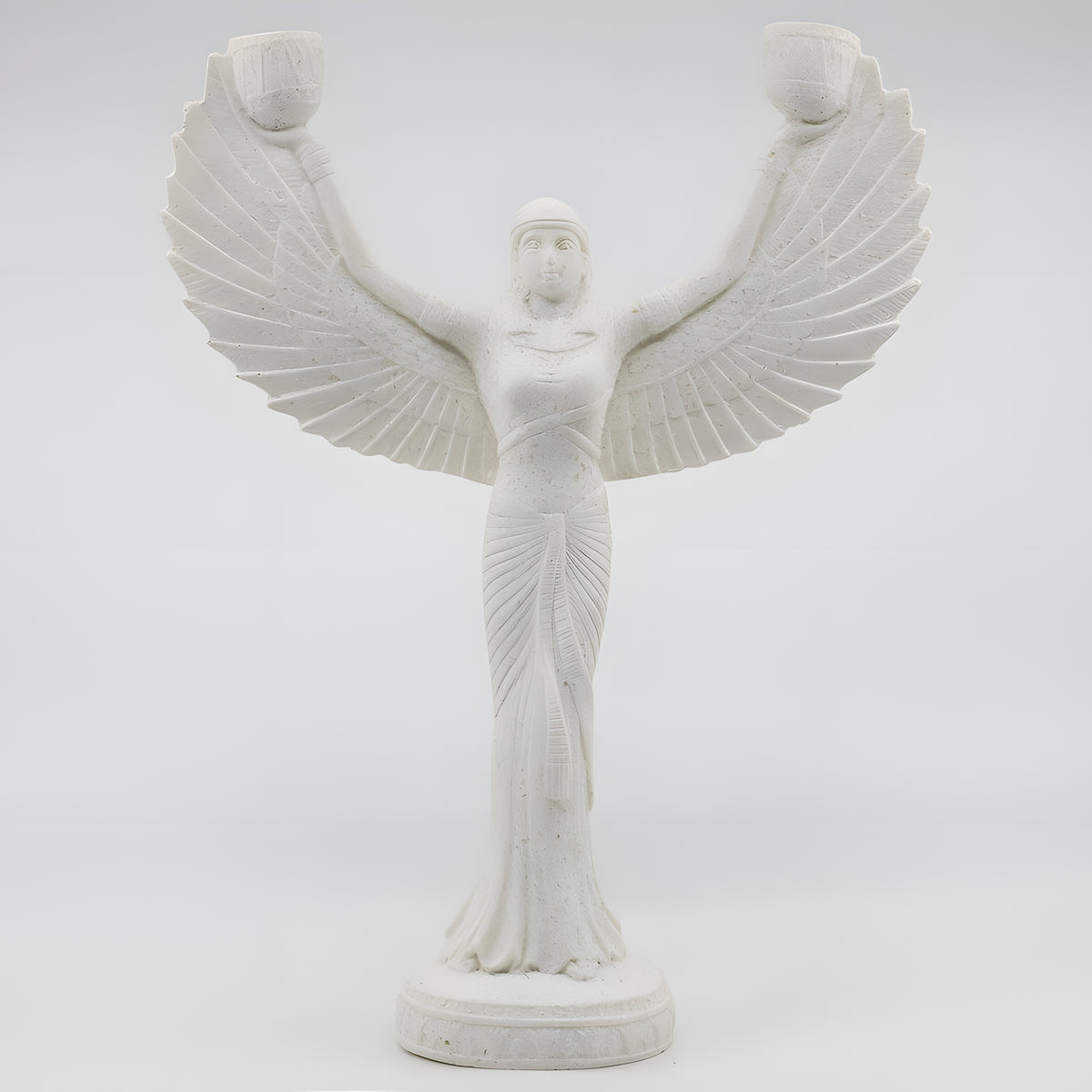 Alabaster Isis candle holder statue with a lit candle