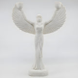 Alabaster Isis candle holder statue with a lit candle