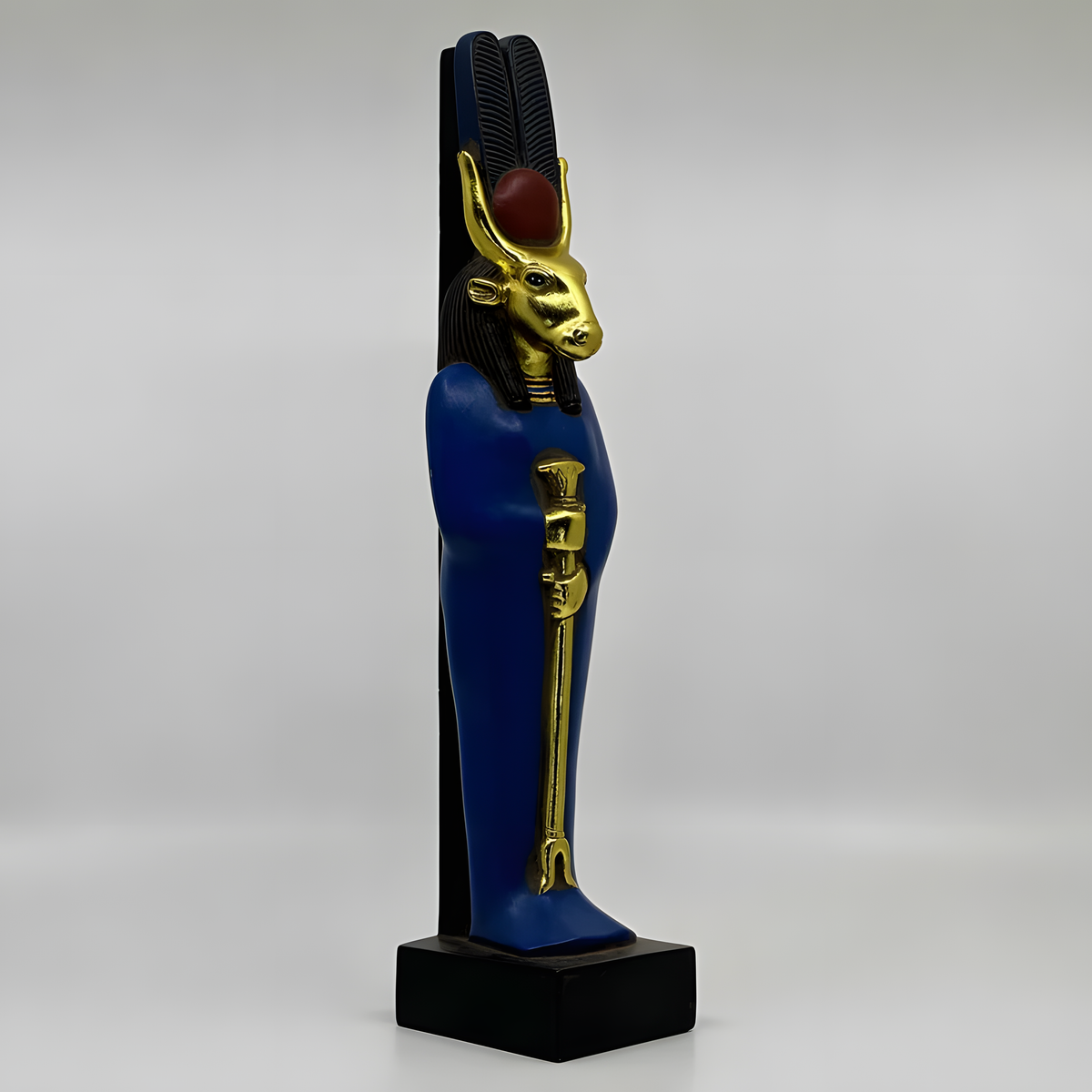 Hathor statue with gold-leaf finish, museum reproduction, side profile view