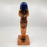 Side view of the handmade copper Tutankhamun coffin statue museum reproduction
