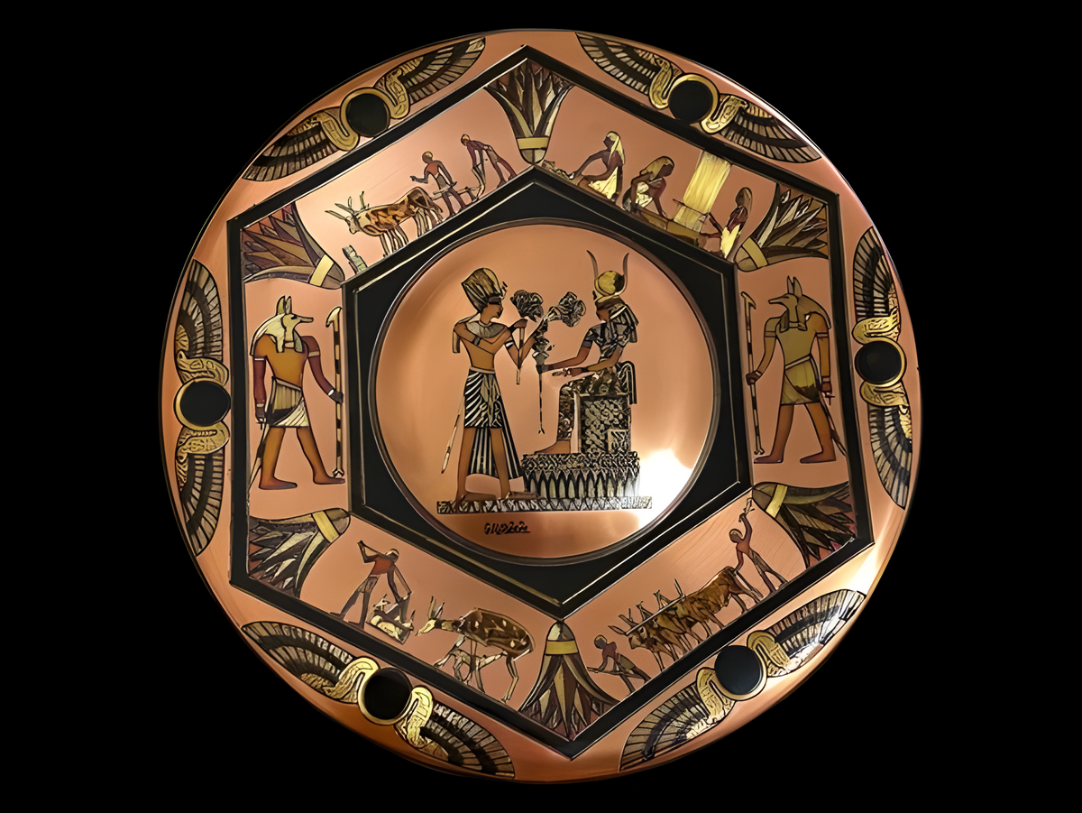 Handmade Egyptian copper wall plate featuring a hand-engraved Pharaonic-style couple relief