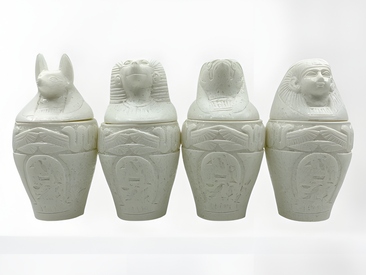 Alabaster canopic jars set, museum reproduction — full set of four jars, front view