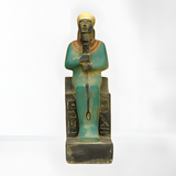 Ptah statue, museum reproduction — seated sculpture on throne, front view