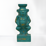 Bes deity statue, museum reproduction — front view with gold-tone accents on blue stone