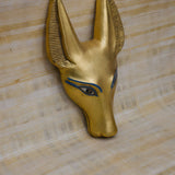 Anubis wall sculpture, museum reproduction, gold-tone accents front view