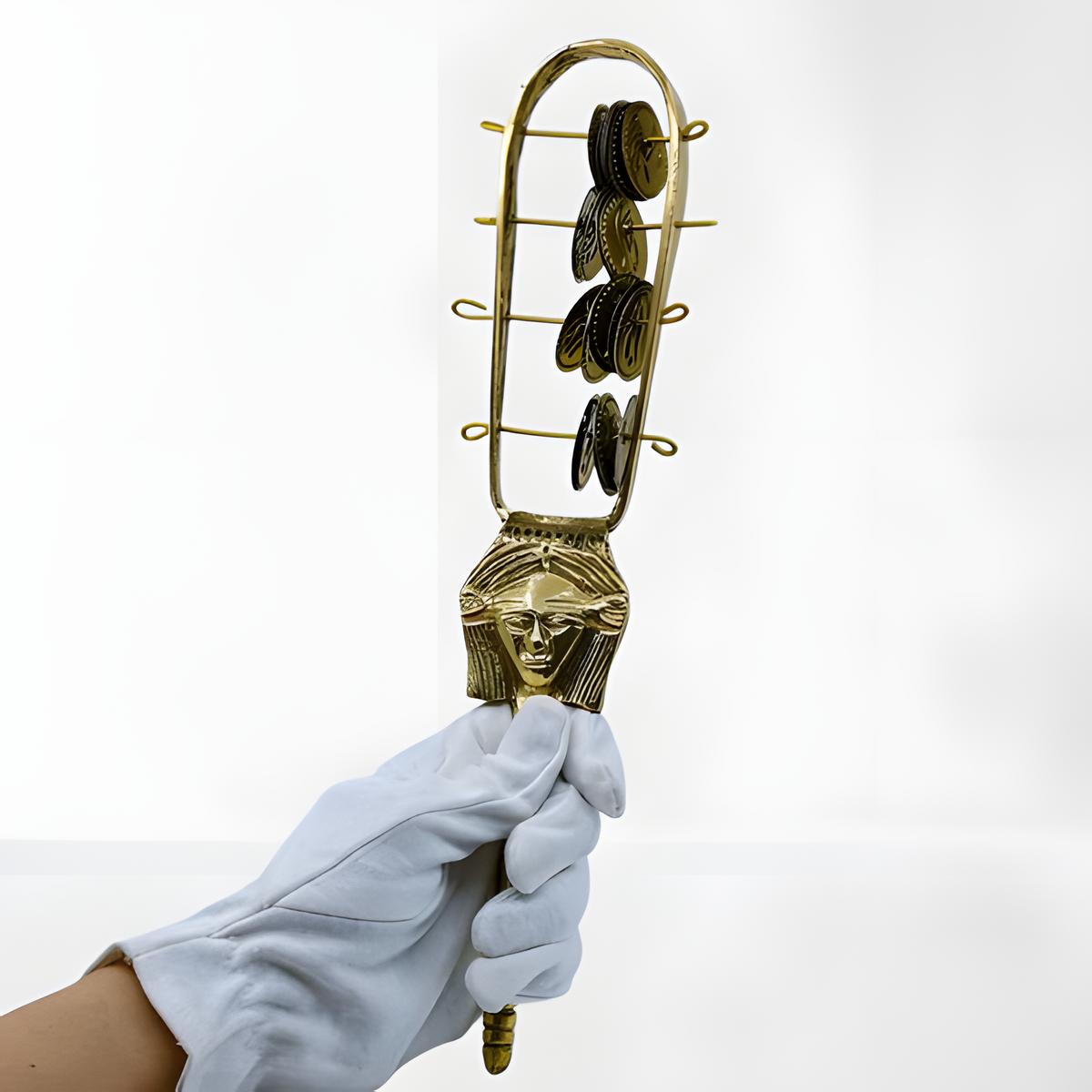Handcrafted brass Hathor sistrum museum reproduction, front view showing Hathor-head motif