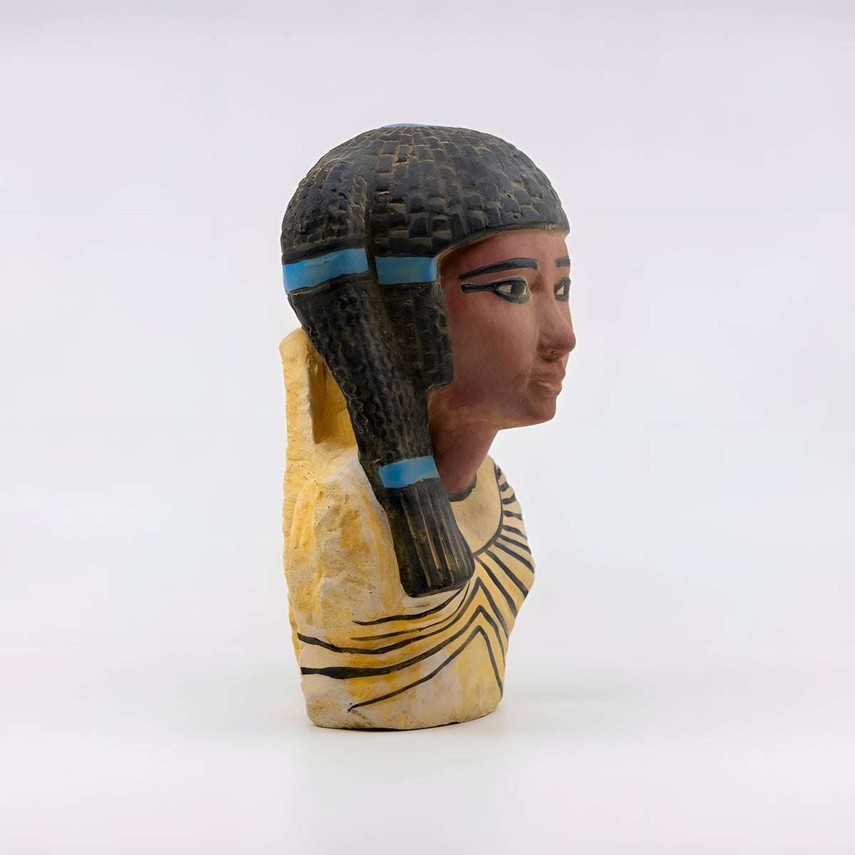 Side view of the handmade Queen Meritaten stone bust museum reproduction