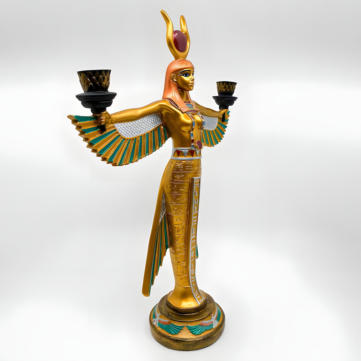 Winged Isis candle holder statue, museum reproduction — angled view of stone carving