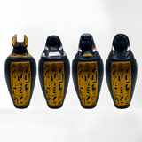 Polystone canopic jar set, museum reproduction — close-up of hand-painted hieroglyphic detail