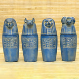 Handcrafted blue stone canopic jar set, museum reproduction — full set of four jars, front view