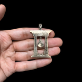Close-up of the Hathor pendant detail on the antique-silver finish necklace