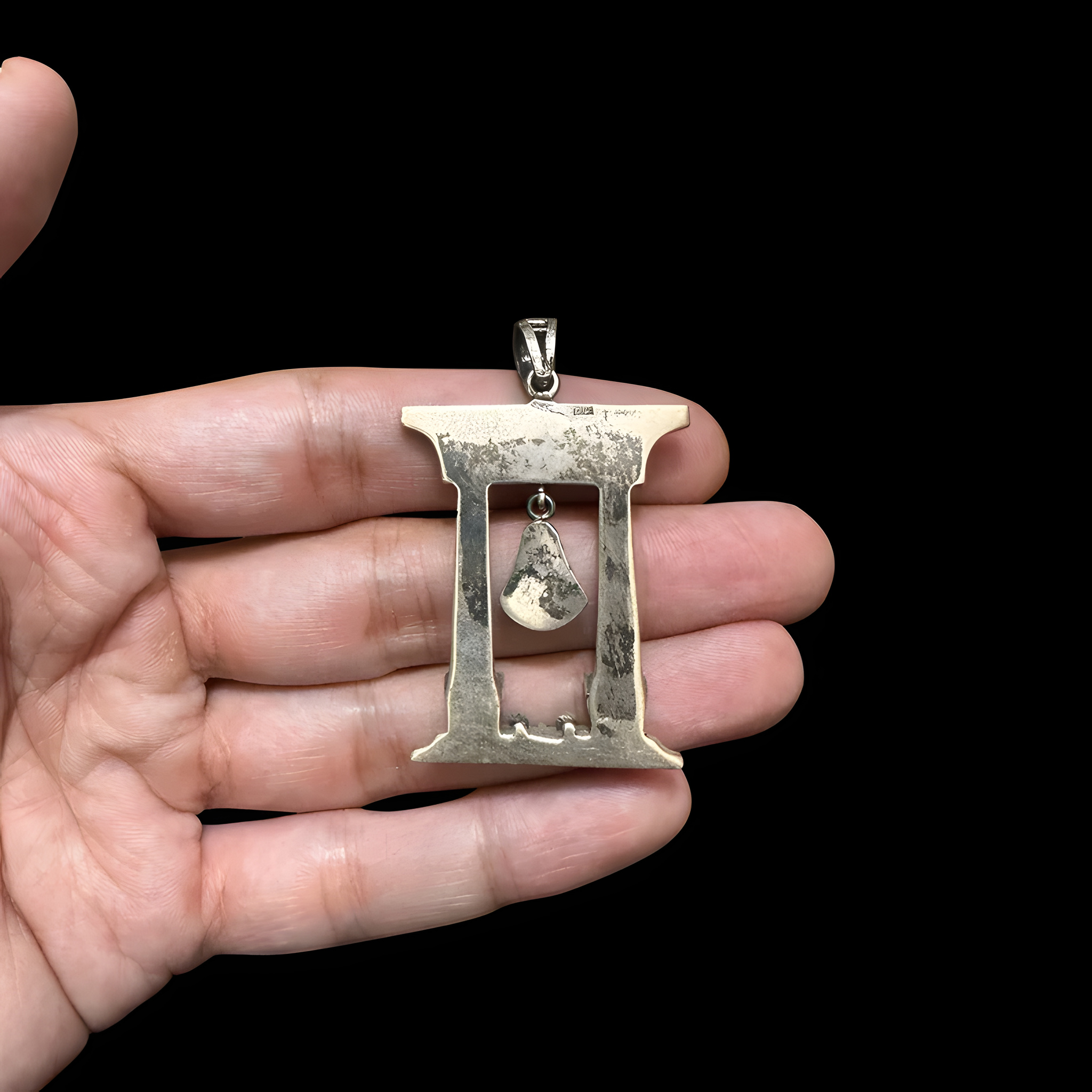 Close-up of the Hathor pendant detail on the antique-silver finish necklace