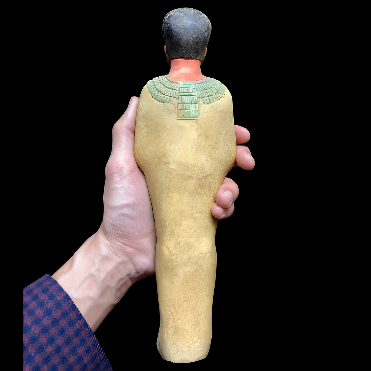 Egyptian Ptah statue, museum reproduction — side view showing carved detail