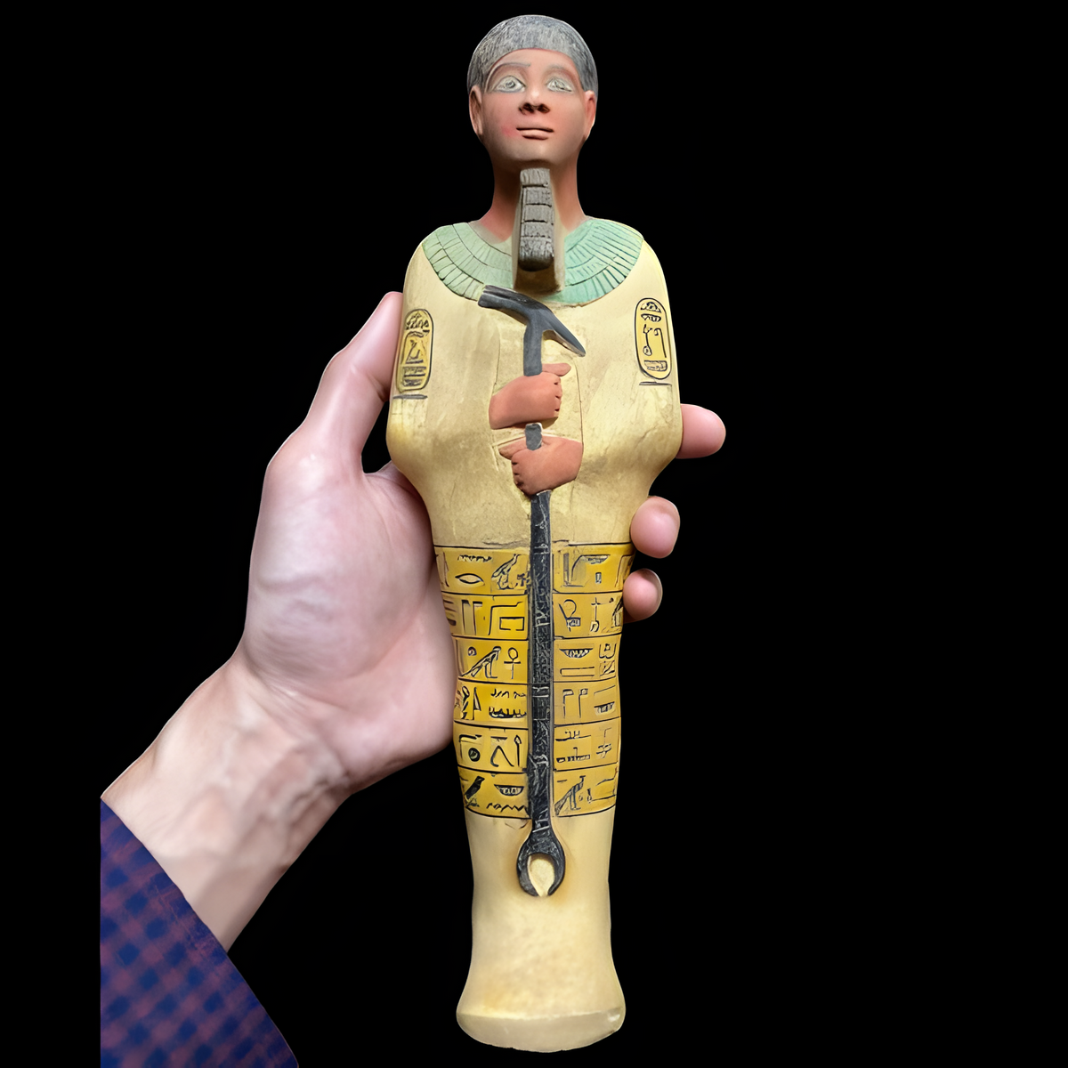 Egyptian Ptah statue, museum reproduction — close-up of hand-painted finish