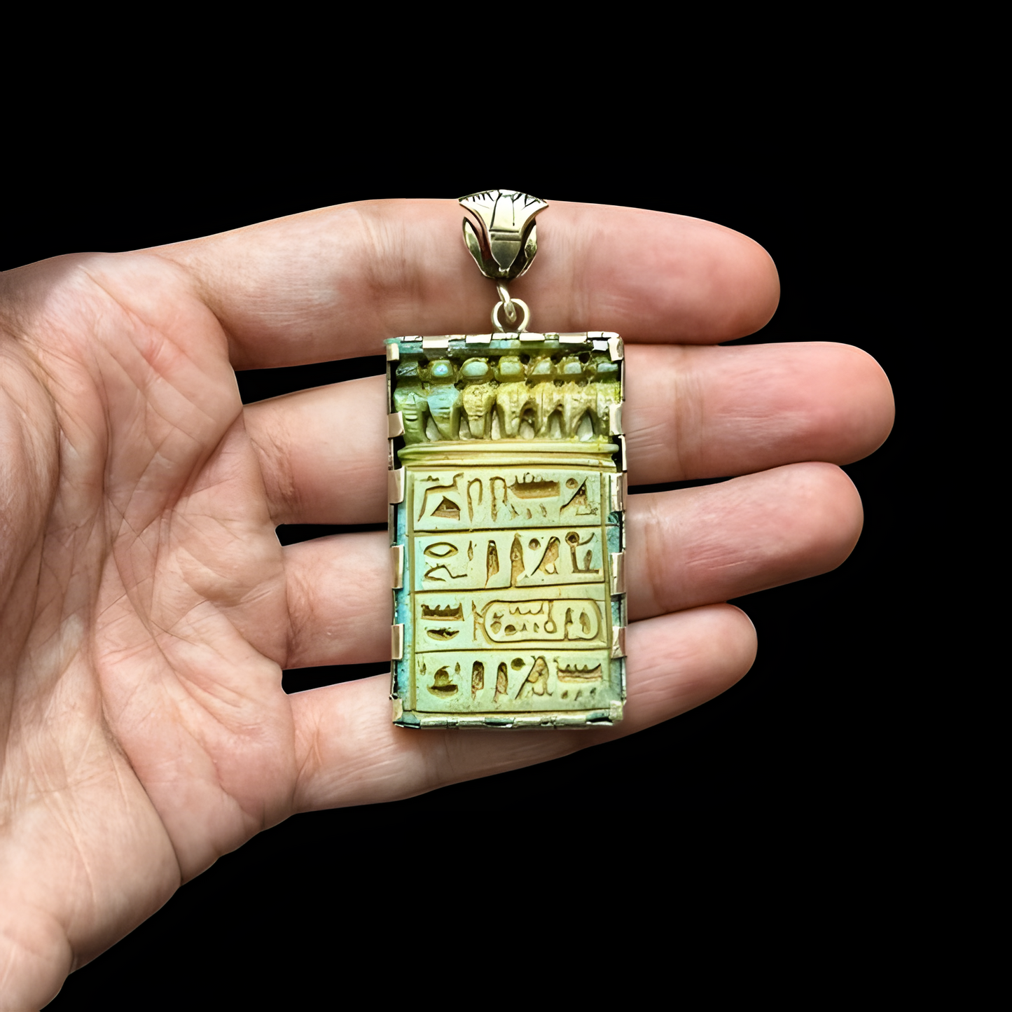 Green hieroglyphic faience-style pendant with silver accents, museum reproduction — front view