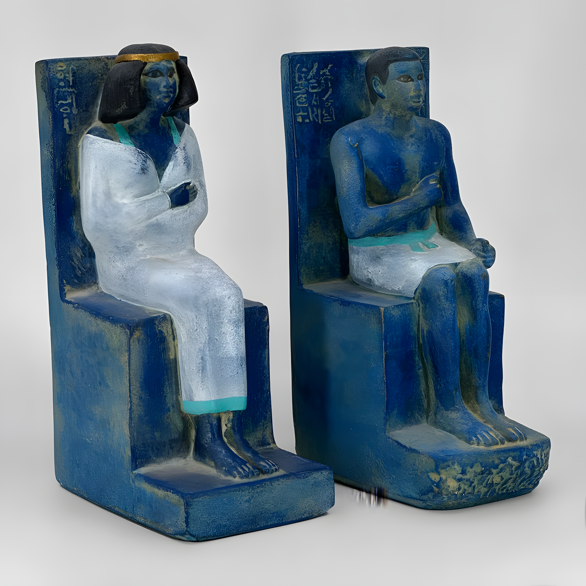 Seated Rahotep and Nofret statue museum reproductions handmade in Egypt, angled view