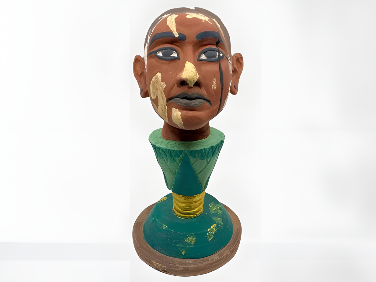 Handmade polystone museum reproduction of the Head of Nefertem, Tutankhamun emerging from a lotus, front view