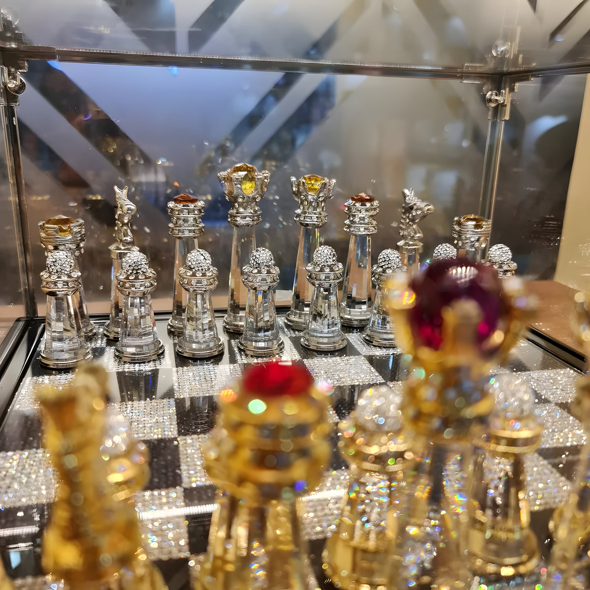 Handcrafted Egyptian crystal chess set displayed in its royal blue velvet box