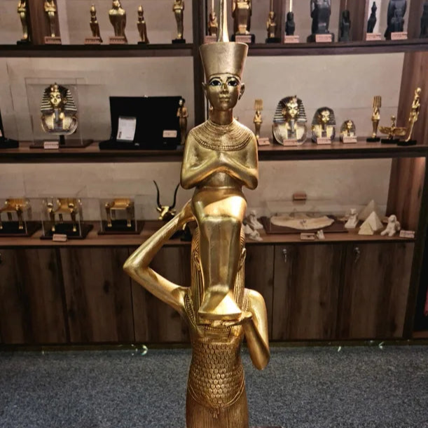 Statue of Goddess Menkeret lifts the mummified King Tutankhamun