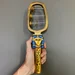 Egyptian sistrum of Hathor, museum reproduction — full view for scale