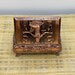 Close-up of the Heh design on the copper alloy jewelry box lid