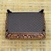 Copper alloy Heh jewelry box shown from a side angle