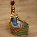 Isis statue storage box replica, closed-wing museum reproduction