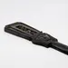 Egyptian sistrum of Hathor, black-finished museum reproduction — detail of carved Hathor-head top