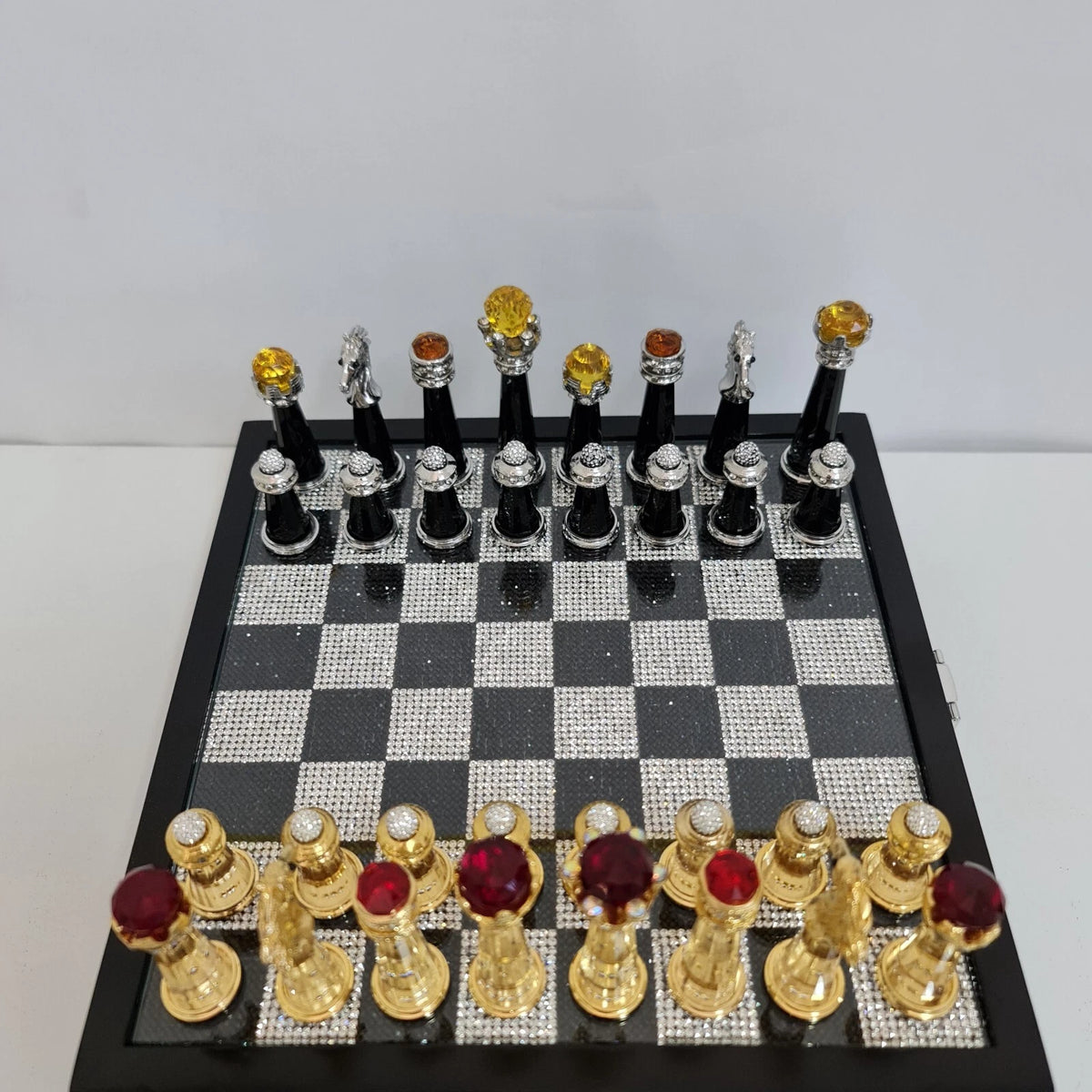 Chess set displayed with royal blue velvet storage box